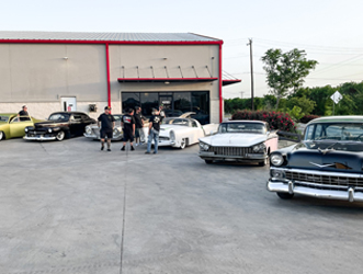 staff-and-cars-outside-body-shop